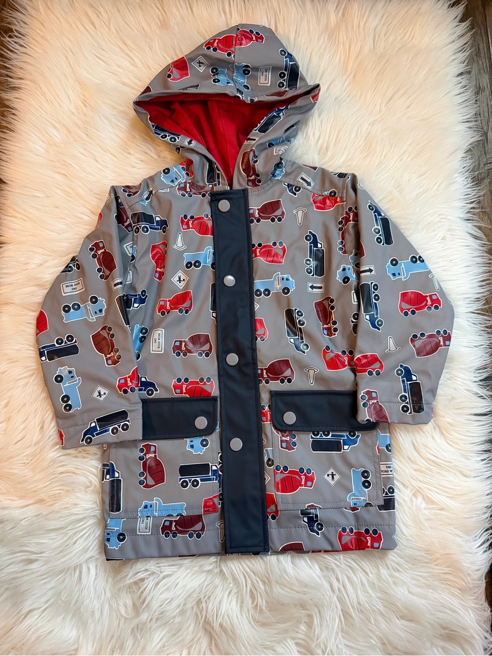 Hartstrings Gray Hooded Raincoat with Red & Blue Trucks